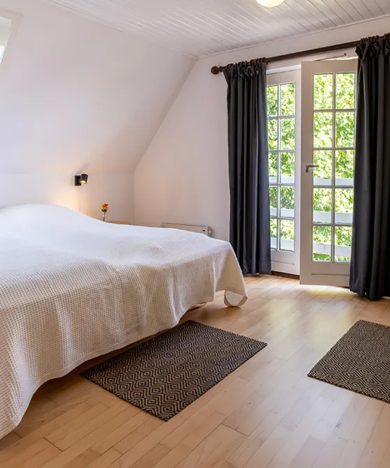 Et af tre soveværelser i Postgadehuset