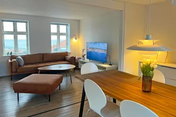 Arnager Seaview - Stue med spisestue