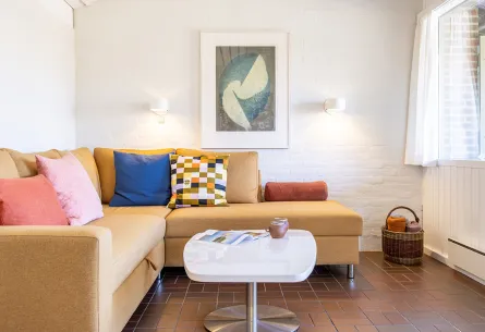 Hyggelig stue og bløde møbler i Feriehus nr. 122 i Hammershuse