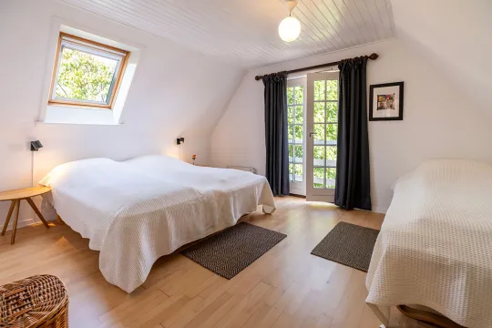 Et af tre soveværelser i Postgadehuset